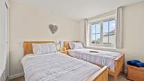 Bedroom 3 is home to this cute twin bed configuration.