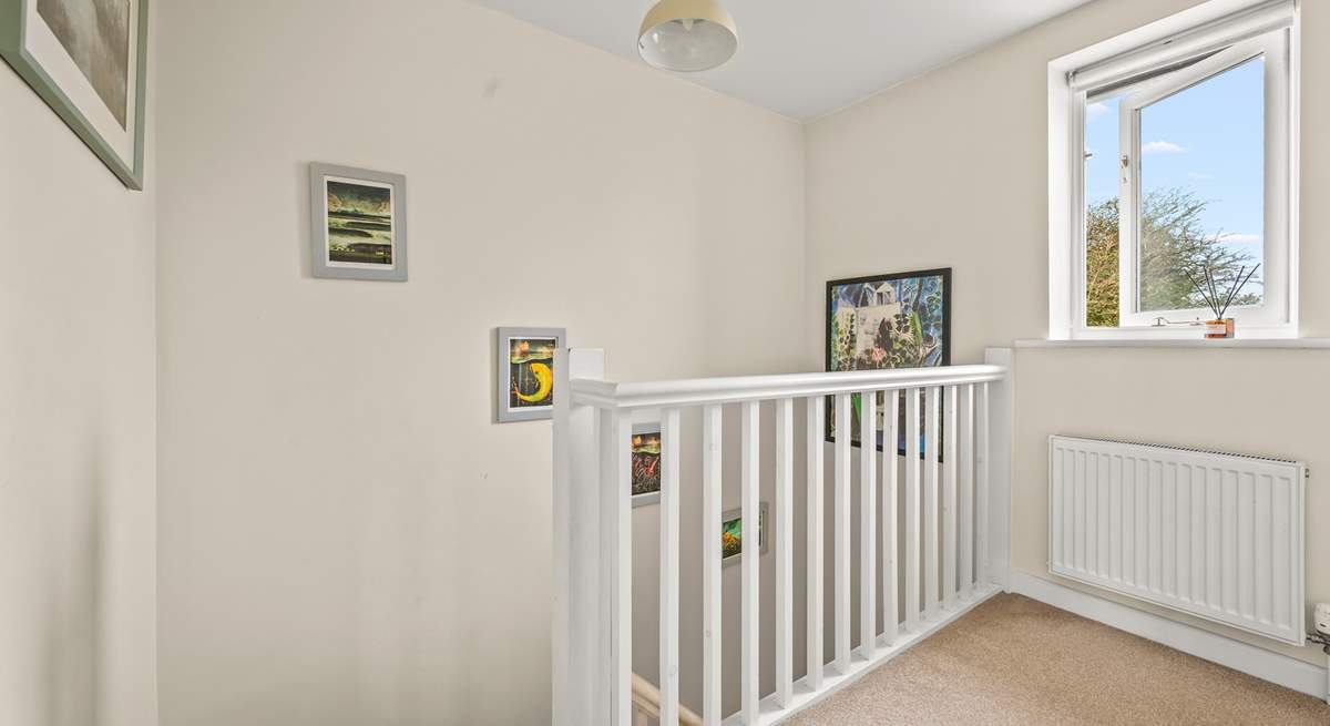 Heading upstairs in the cottage, this spacious landing area links the first floor.