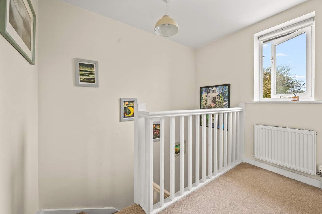 Heading upstairs in the cottage, this spacious landing area links the first floor.