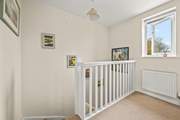 Heading upstairs in the cottage, this spacious landing area links the first floor.