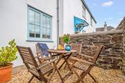 Sitting in the enclosed courtyard is the perfect space to enjoy a good book or touch of dining al fresco.