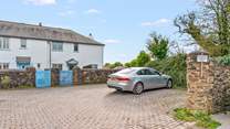 Your parking space is to the far right corner, just in front of the cottage wall.