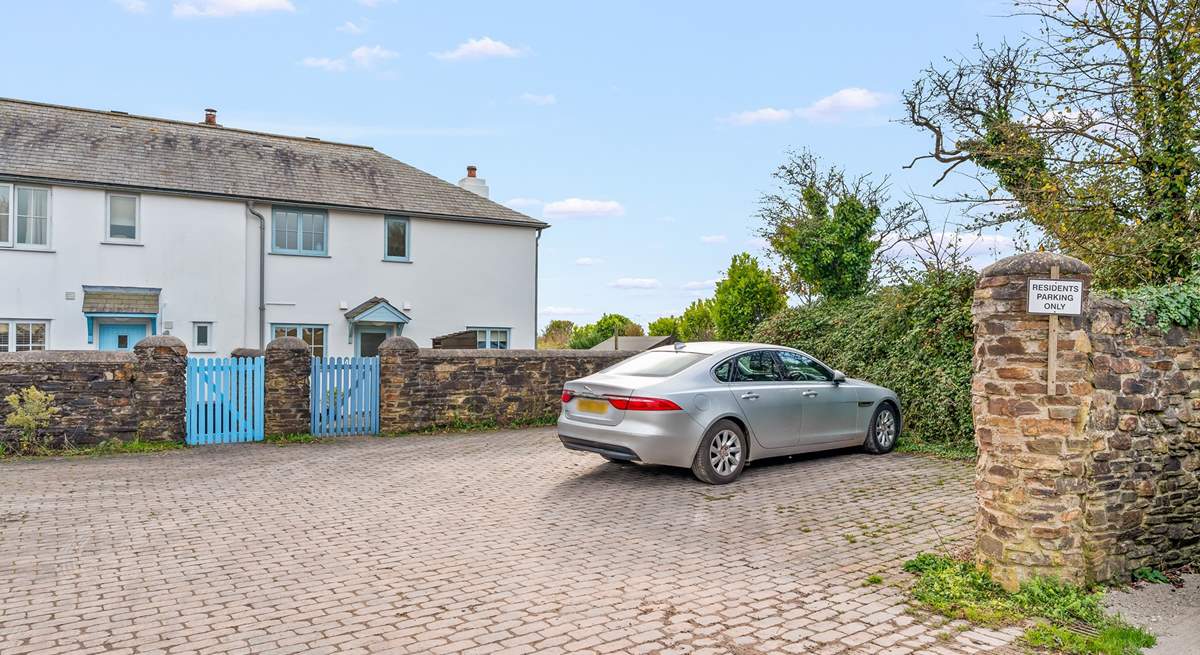 Your parking space is to the far right corner, just in front of the cottage wall.