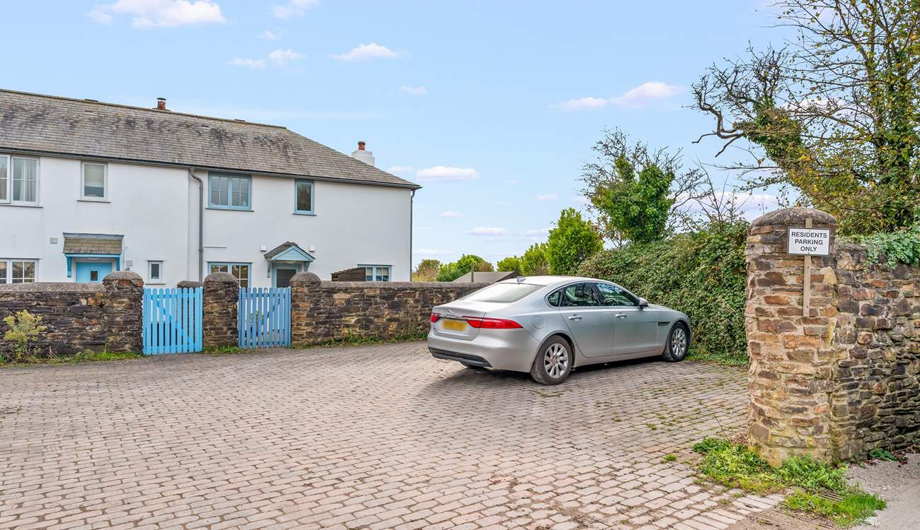 Your parking space is to the far right corner, just in front of the cottage wall.