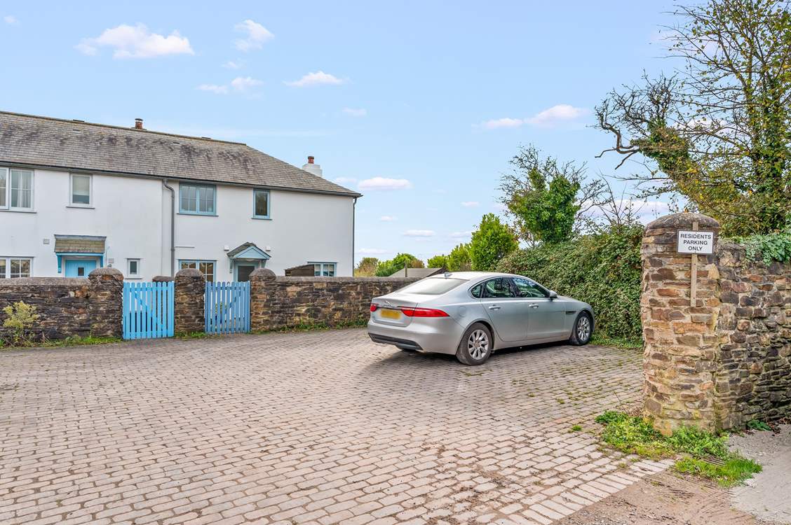 Your parking space is to the far right corner, just in front of the cottage wall.