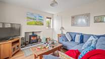 The living-room boasts a large Smart TV. Perfect for those movie nights cuddled up in front of the wood-burner.