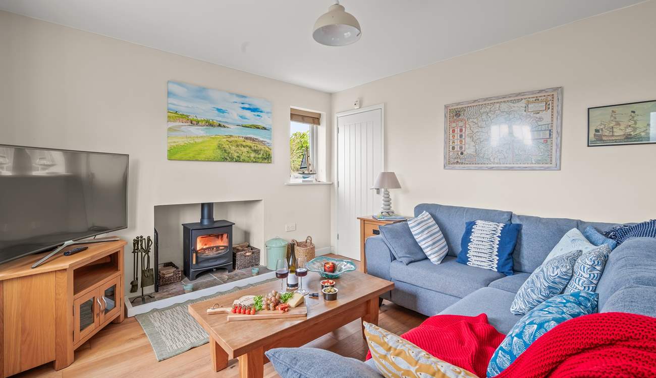 The living-room boasts a large Smart TV. Perfect for those movie nights cuddled up in front of the wood-burner.