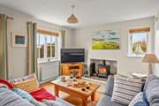 The cosy living-room area is the perfect place to snuggle up after a day exploring the glorious South Hams.