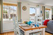 Enjoying any meal at this dining-table is a pleasure. Especially as you can fling the top stable-door open and enjoy the great outdoors from the comfort of the dining-area.