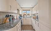 The fully equipped kitchen holds everything the chef of the party needs and more. - Thumbnail Image