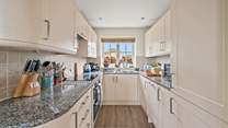 The fully equipped kitchen holds everything the chef of the party needs and more.