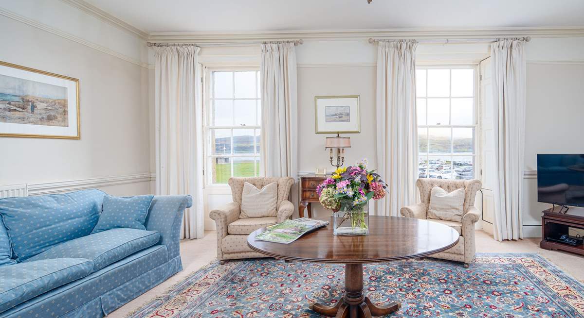 Calming, pretty blue hues marry perfectly with sea views in the elegant sitting-room. 