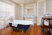 Soak in a hot, bubbly bath after a day exploring the beauty of the surrounding area.