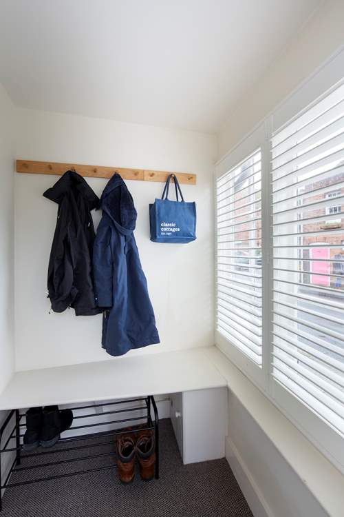 The porch has plenty of space for boots, shoes and coats.