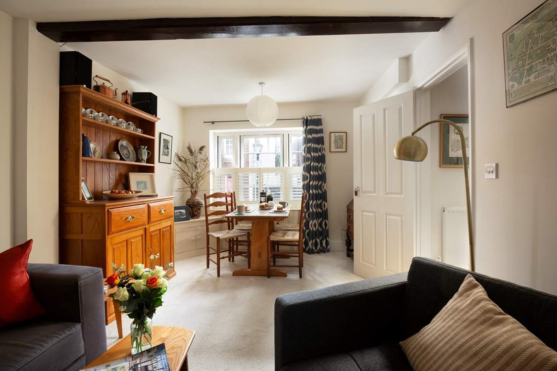 The cosy sitting/dining-room is perfect for relaxing after a day exploring.