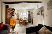 The cosy sitting/dining-room is perfect for relaxing after a day exploring.