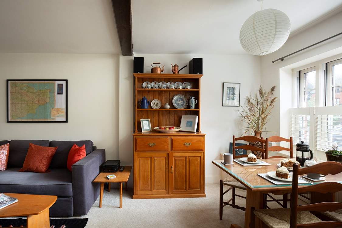 The sitting/dining-room is perfect for sociable dining.