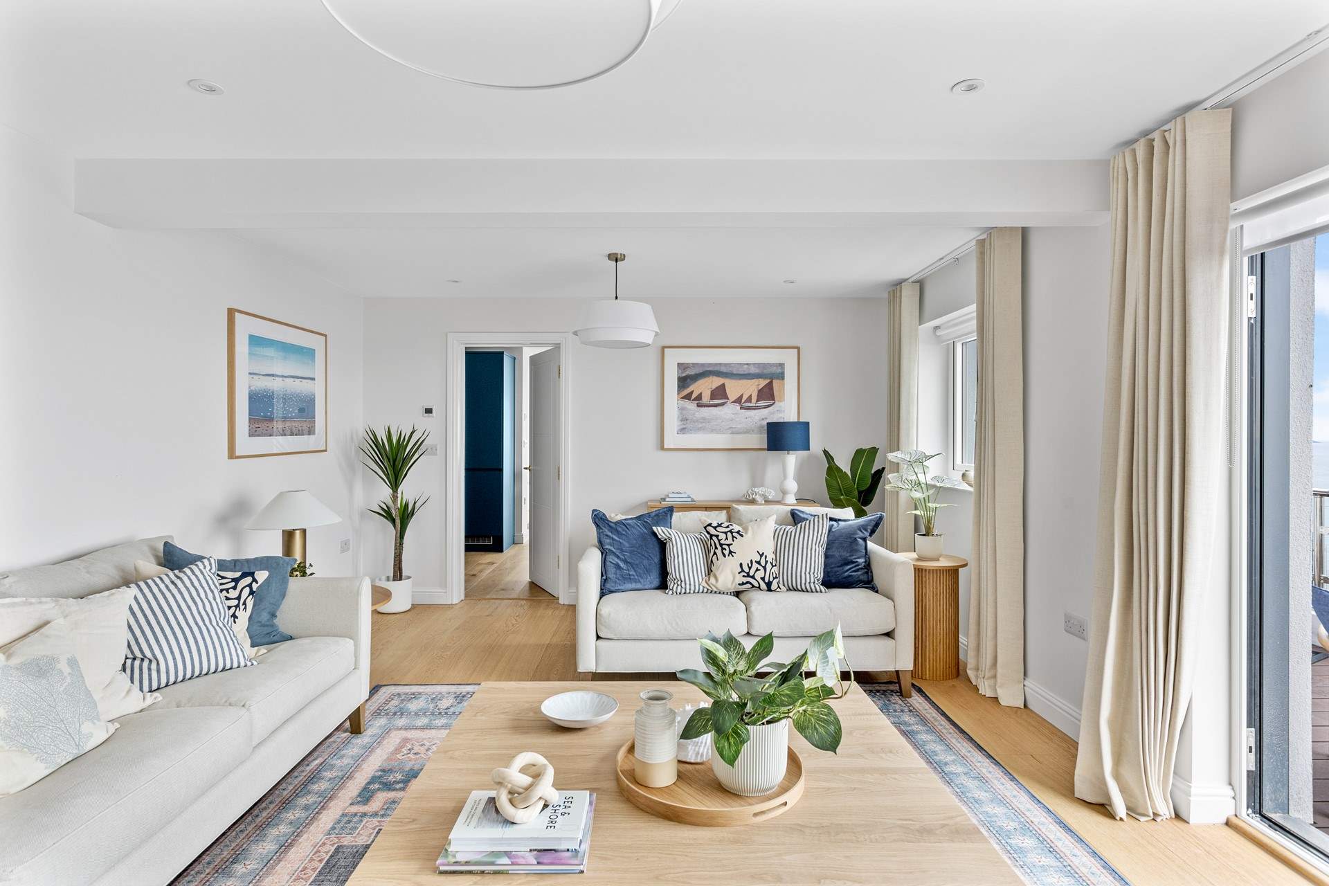 Coastal tones are the order of the day in the sitting-room.