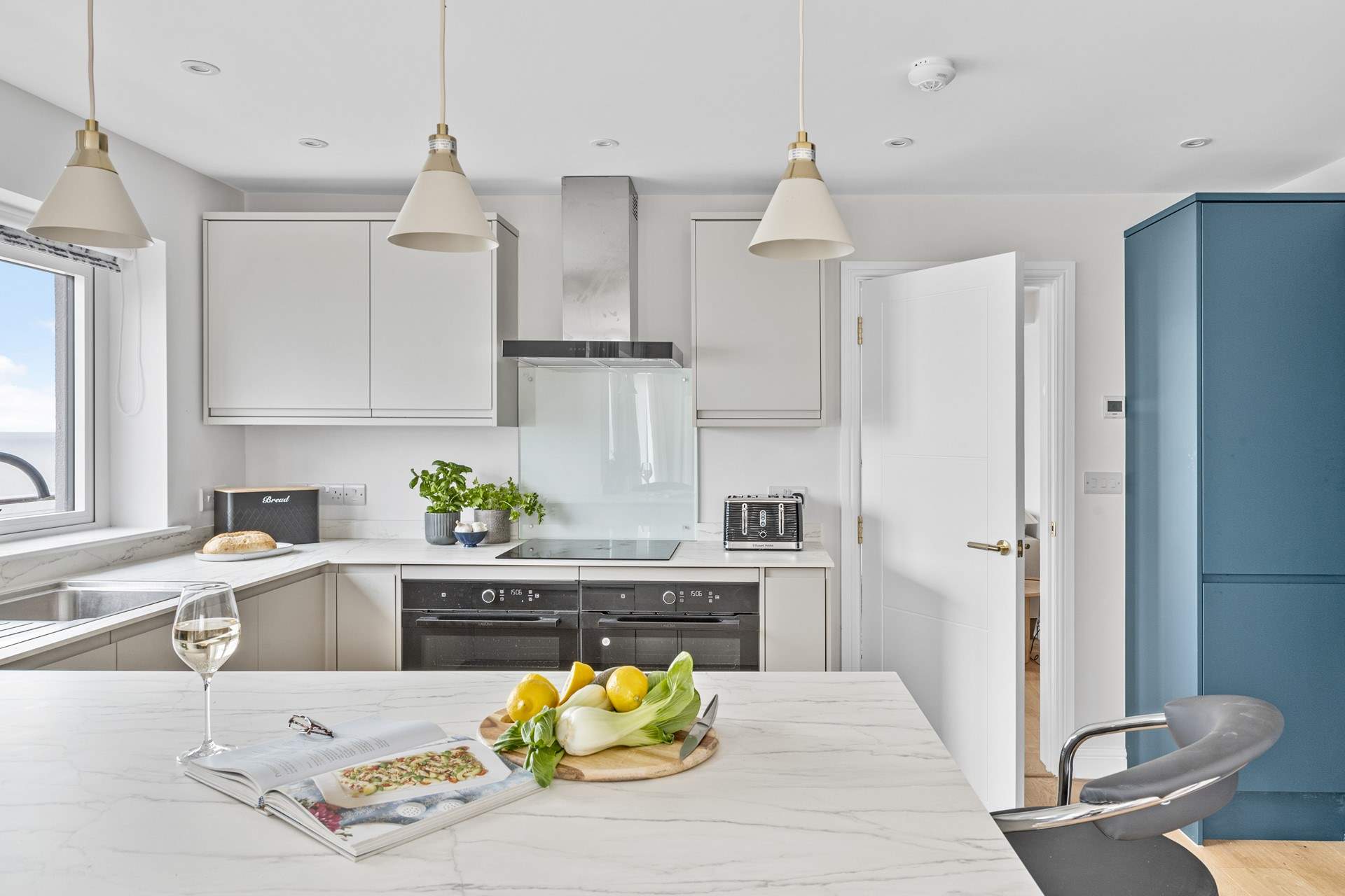 The stylish kitchen is fully equipped.