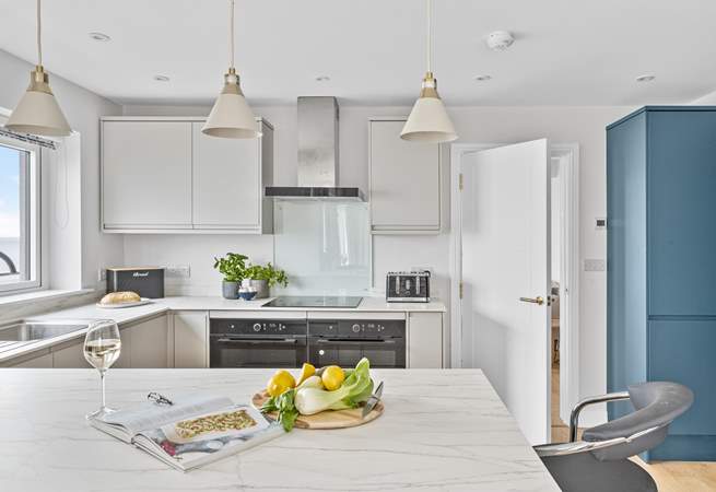 The stylish kitchen is fully equipped.