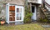 The patio door from the kitchen opens out to reveal the views. - Thumbnail Image