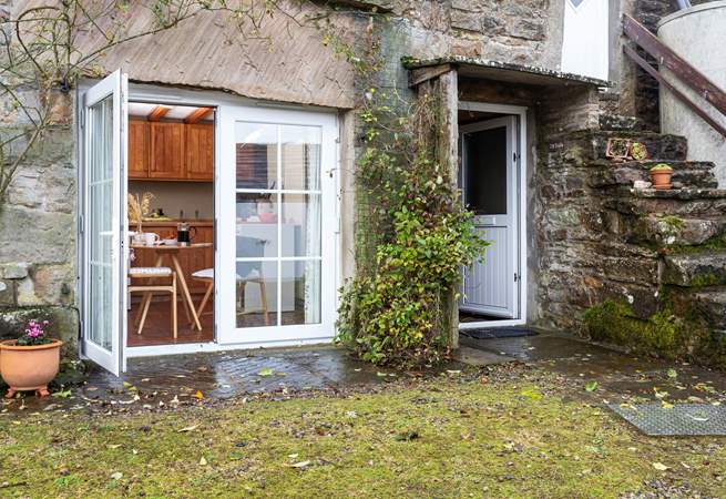 The patio door from the kitchen opens out to reveal the views.