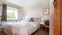 A lovely country-style bedroom to retire to.