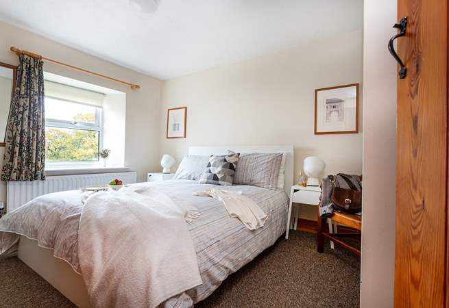 A lovely country-style bedroom to retire to.