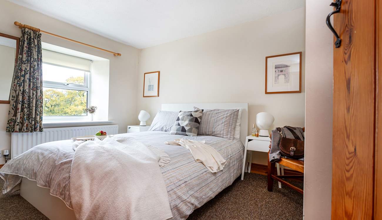 A lovely country-style bedroom to retire to.