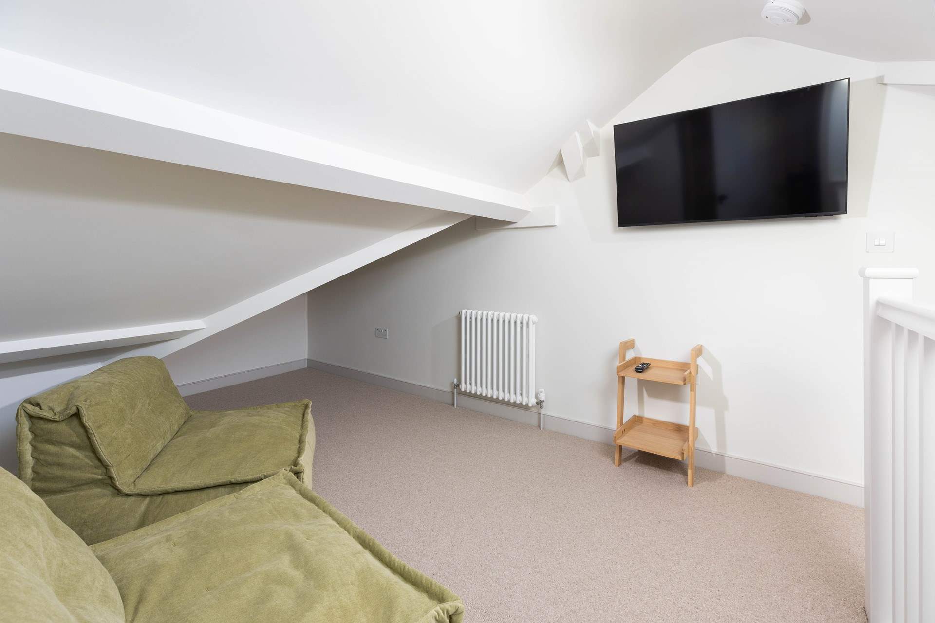 Lastly, climb the last set of stairs up to the third floor where you will discover the perfect hangout room for watching a film or rugby match.  Being in the loft you will have to watch the sloping ceilings.