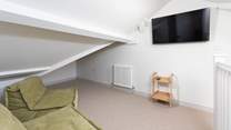 Lastly, climb the last set of stairs up to the third floor where you will discover the perfect hangout room for watching a film or rugby match.  Being in the loft you will have to watch the sloping ceilings.