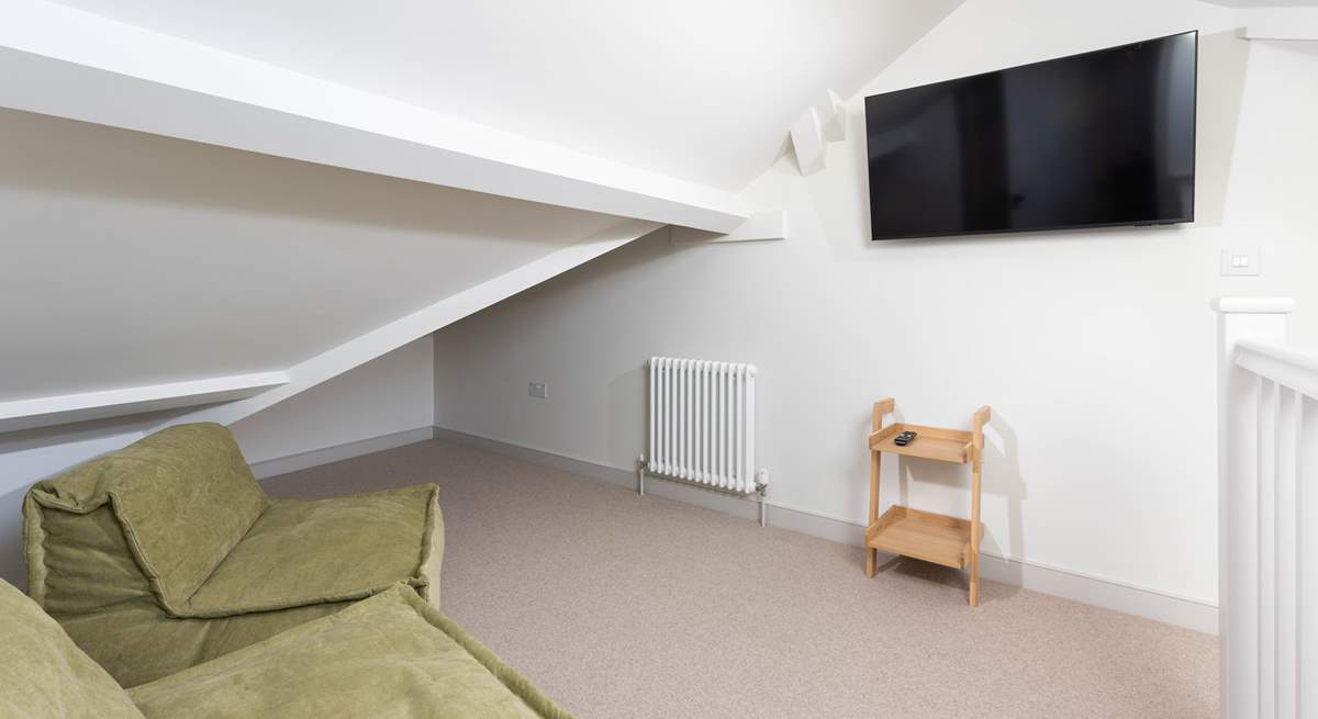 Lastly, climb the last set of stairs up to the third floor where you will discover the perfect hangout room for watching a film or rugby match.  Being in the loft you will have to watch the sloping ceilings.