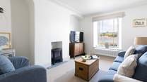 The sitting-room offers the perfect setting to sit back and relax into a holiday by the sea.