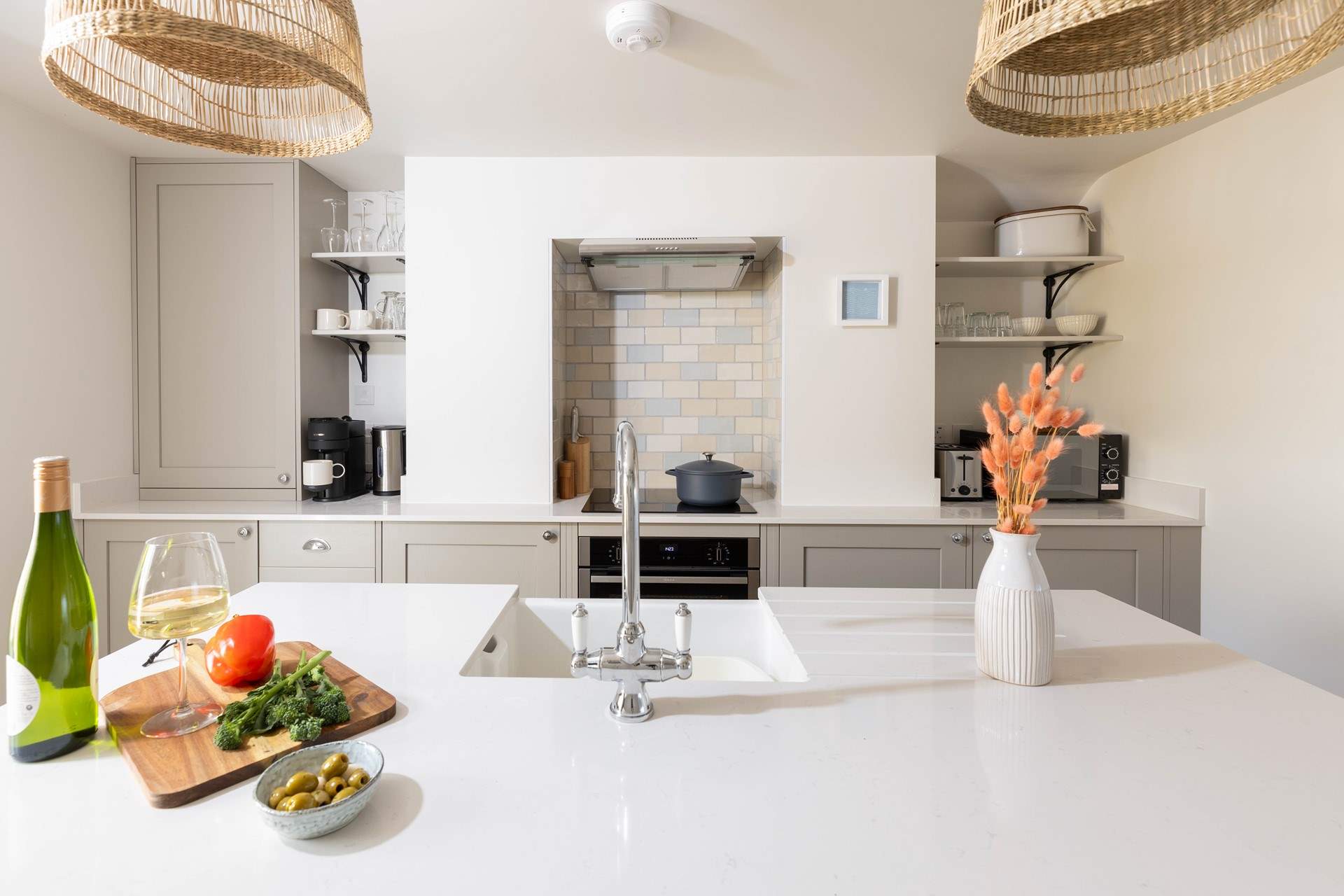 Whilst the chef cooks up a storm take a stool and pour yourself a chilled glass of vino.