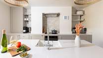 Whilst the chef cooks up a storm take a stool and pour yourself a chilled glass of vino.