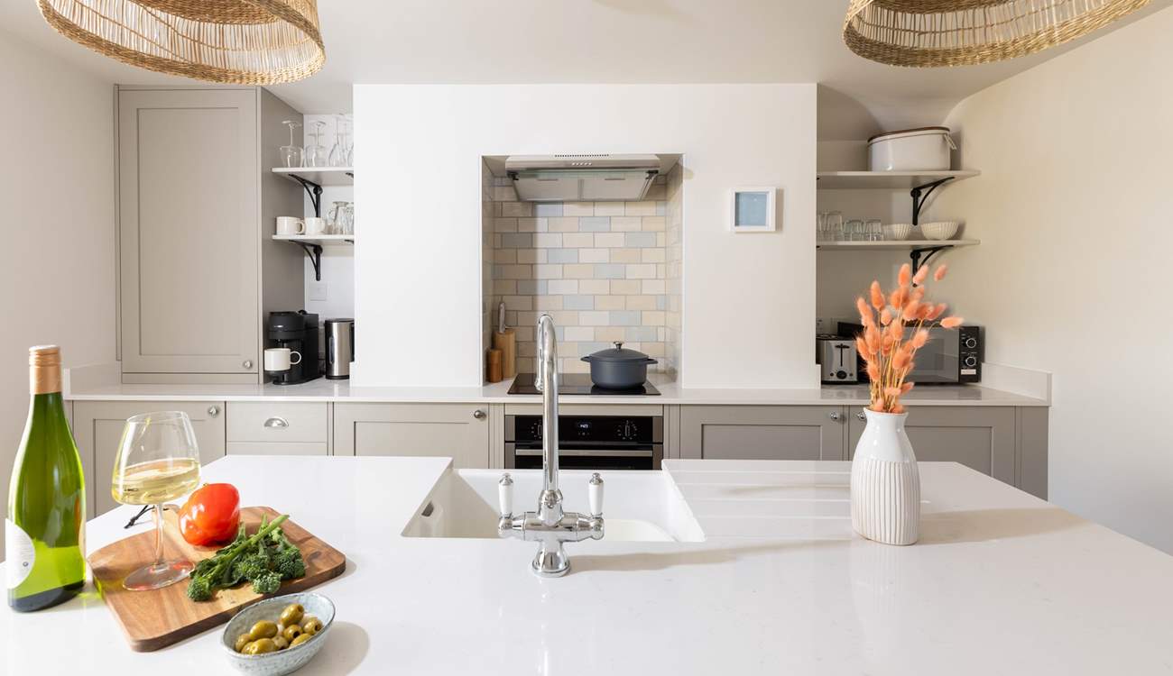 Whilst the chef cooks up a storm take a stool and pour yourself a chilled glass of vino.