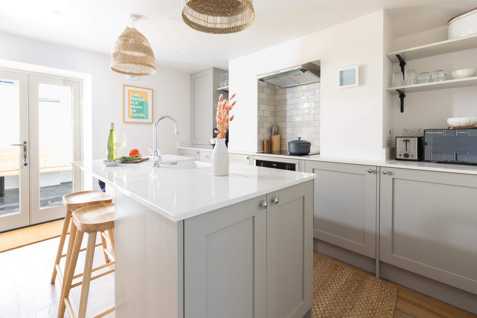 From the dining-area walk through to the modern fully equipped kitchen. On a sunny morning open the patio doors on to the courtyard.