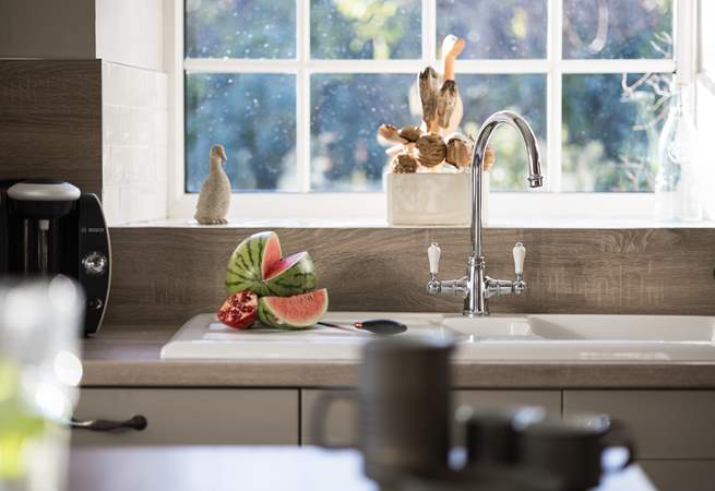 Look out onto the pretty garden.