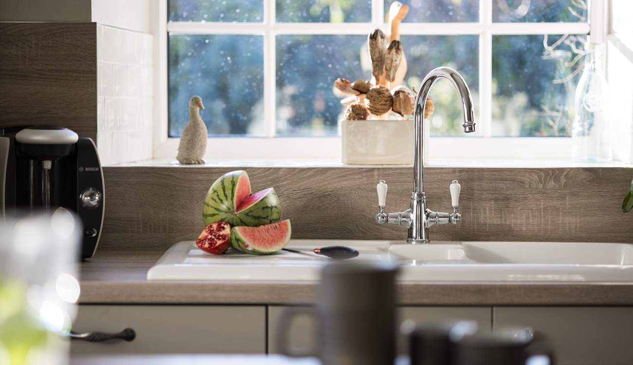 Look out onto the pretty garden.