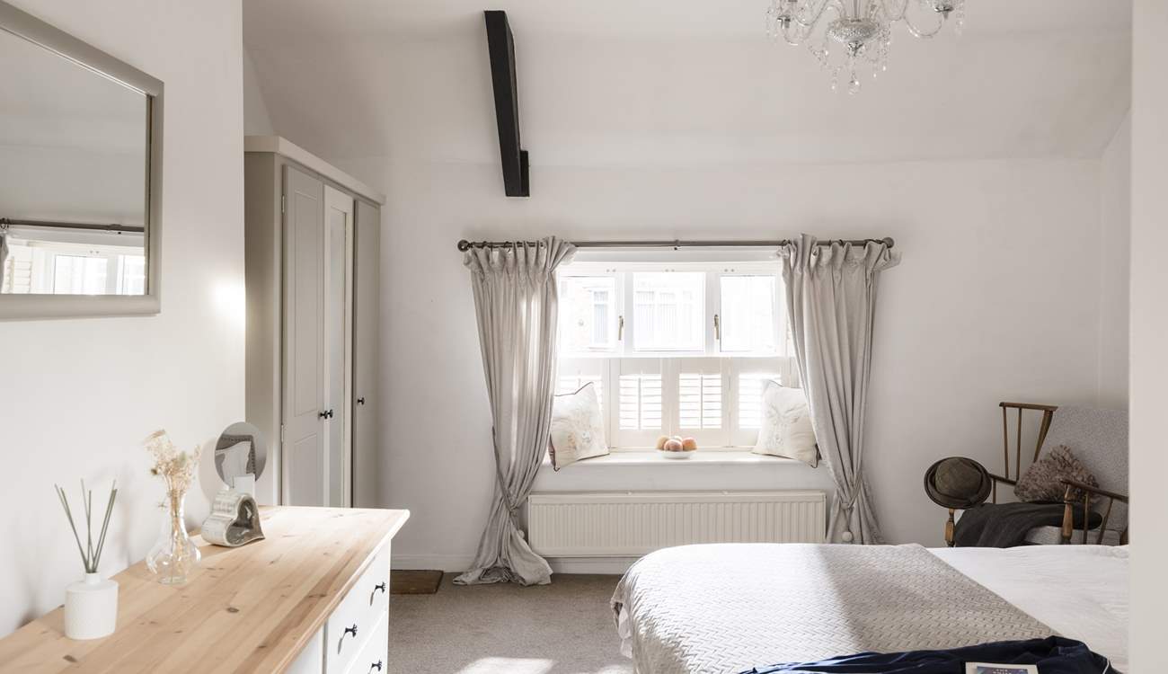 The main bedroom has a king-size double bed and a stylish en suite, relax in style. 
