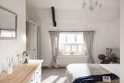 The main bedroom has a king-size double bed and a stylish en suite, relax in style.