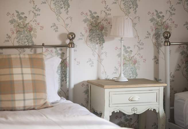 The twin room is pretty as a picture.