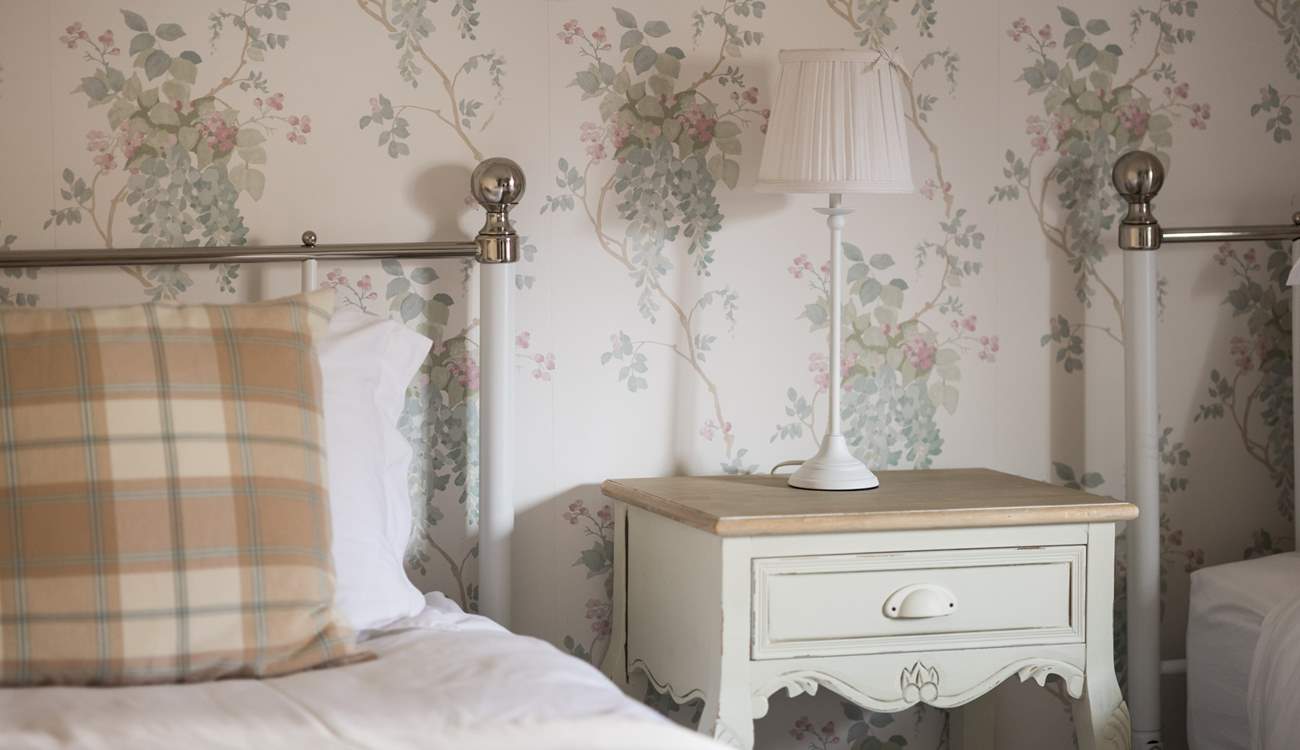 The twin room is pretty as a picture.