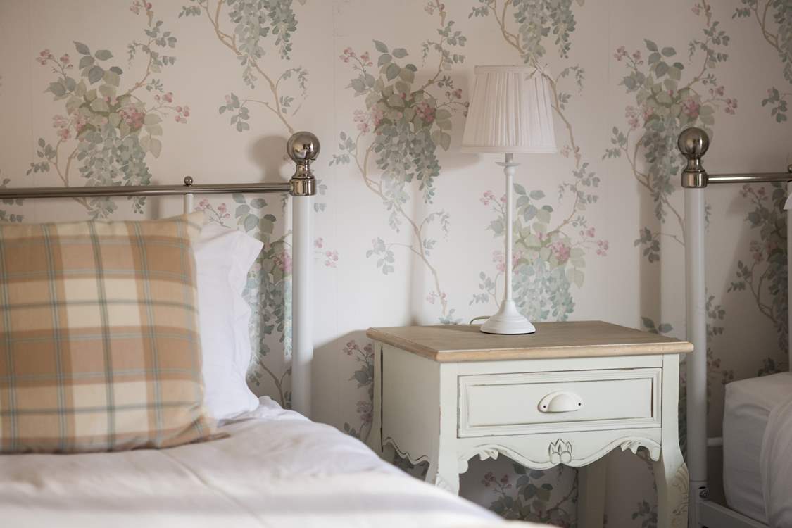 The twin room is pretty as a picture.