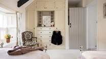 Getting ready for a day at the coast is a dream in the twin bedroom. 