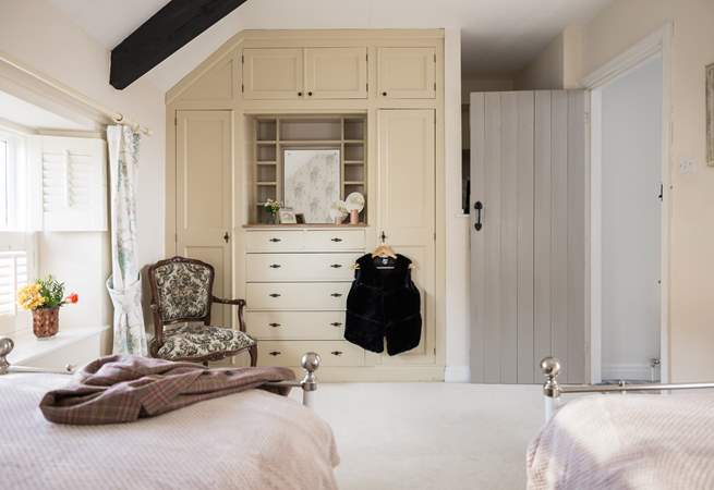 Getting ready for a day at the coast is a dream in the twin bedroom. 