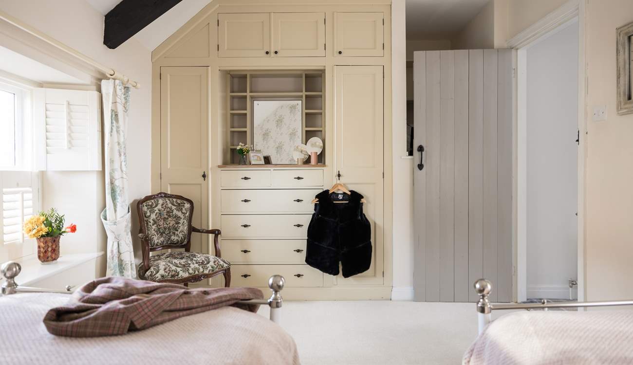 Getting ready for a day at the coast is a dream in the twin bedroom. 