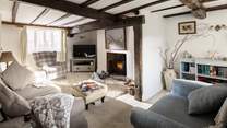The sitting-room is stylish and cosy.