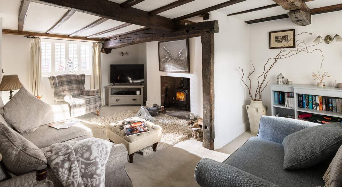 The sitting-room is stylish and cosy.