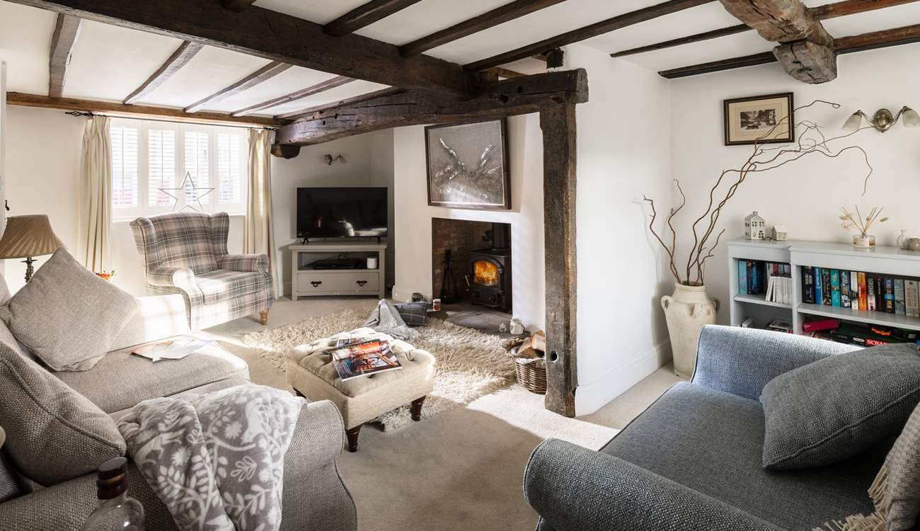 The sitting-room is stylish and cosy.